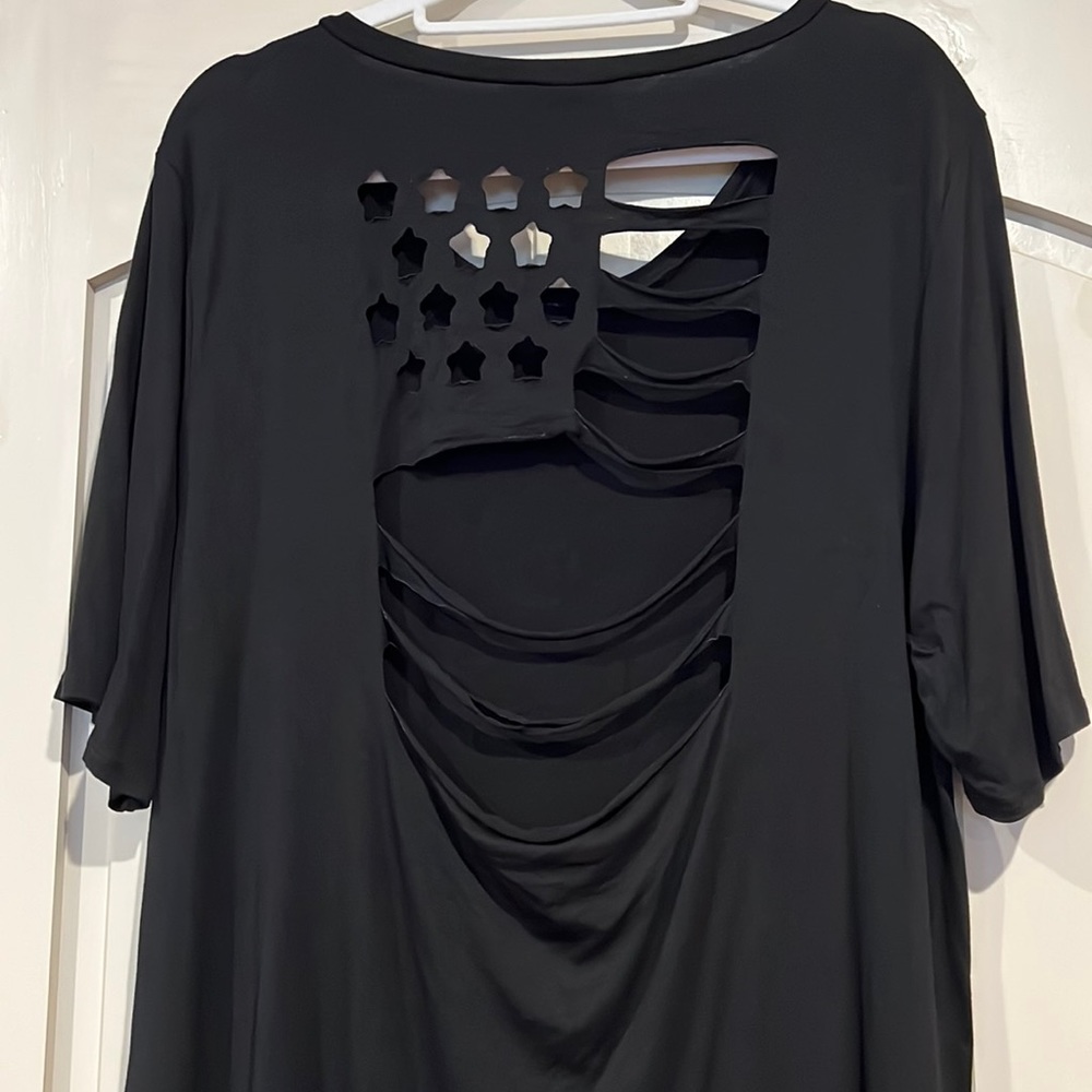 Blumin black shirt with flag cutout on back, excellent used condition.